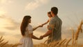 Happy baby in arms of father and mother. little daughter, dad and mom play in wheat field. baby travels across field Royalty Free Stock Photo