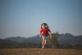 Happy baby asian girl smiling. little girl running and smiling at sunset happy baby girl smiling. little baby running at sunset.