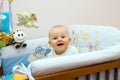 Happy baby in bed Royalty Free Stock Photo