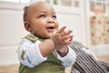 Happy, baby and black child clapping in home, having fun or enjoying time alone. African newborn, children and toddler
