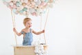 Happy baby boy in a fairy magic hot air balloon Royalty Free Stock Photo