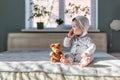 Happy baby boy in grey pyjamas Royalty Free Stock Photo