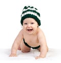 Happy baby boy in knitted hat crawling over white Royalty Free Stock Photo