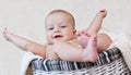 Happy baby boy lying in basket Royalty Free Stock Photo