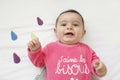 Happy baby boy lying on his bed crib Royalty Free Stock Photo