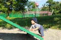 Happy baby boy on an obstacle on kids playground Royalty Free Stock Photo