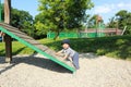 Happy baby boy on an obstacle on kids playground Royalty Free Stock Photo