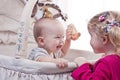 Happy baby boy playing with his sister Royalty Free Stock Photo