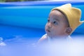 Happy Adorable Baby Boy Playing water and toy ball in the Swimming Pool Royalty Free Stock Photo