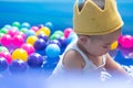 Happy  Baby Boy Playing water and toy ball in the Swimming Pool Royalty Free Stock Photo