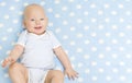 Happy Baby Boy, Smiling Infant Kid Portrait, Five Months Old Child lying on Blue