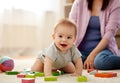 Happy baby boy with toy blocks on carpet at home Royalty Free Stock Photo