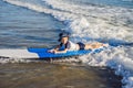 Happy baby boy - young surfer ride on surfboard with fun on sea waves. Active family lifestyle, kids outdoor water sport Royalty Free Stock Photo