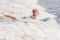 Happy baby boy - young surfer ride on surfboard with fun on sea waves. Active family lifestyle, kids outdoor water sport Royalty Free Stock Photo