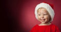 Happy baby in a Christmas cap Royalty Free Stock Photo