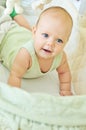 Happy baby in crib Royalty Free Stock Photo
