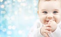 Happy baby face over blue holidays lights Royalty Free Stock Photo