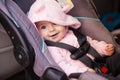 Happy baby girl in a car seat Royalty Free Stock Photo