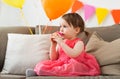 Happy baby girl eating cupcake on birthday party Royalty Free Stock Photo