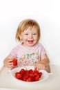 Happy baby eating strawberry Royalty Free Stock Photo