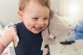 Happy baby girl with her cuddly toy