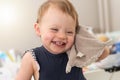 Happy baby girl with her cuddly toy