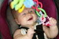 Happy Baby Girl Playing in Car Safety Seat Royalty Free Stock Photo