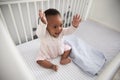Happy Baby Girl Playing In Nursery Cot Royalty Free Stock Photo