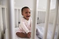 Happy Baby Girl Playing In Nursery Cot Royalty Free Stock Photo