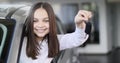 Happy baby girl showing the key of his new car. Auto business, car sale, technology and people concept - happy male with Royalty Free Stock Photo