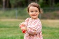 happy baby girl with soap bubble blower in summer Royalty Free Stock Photo