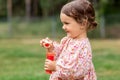 happy baby girl with soap bubble blower in summer Royalty Free Stock Photo