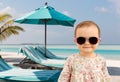 happy baby girl in sunglasses on summer beach Royalty Free Stock Photo