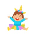 Happy baby girl in unicorn costume sitting on the floor vector Illustration on a white background Royalty Free Stock Photo