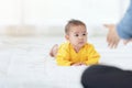 Happy baby go on caepet at home. child and parenthood concept, mother playing with little baby at home Royalty Free Stock Photo