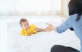 Happy baby go on caepet at home. child and parenthood concept, mother playing with little baby at home Royalty Free Stock Photo