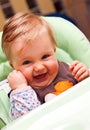 Happy baby in high chair