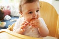 Happy Baby In High Chair At Meal Time Royalty Free Stock Photo