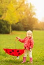 Happy baby holding red umbrella Royalty Free Stock Photo