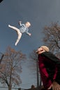 Happy baby jumping up on trampoline Royalty Free Stock Photo