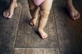 Happy baby learning to walk with mother help Royalty Free Stock Photo