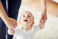Happy baby learning to walk with mother help Royalty Free Stock Photo
