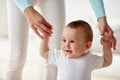 Happy baby learning to walk with mother help Royalty Free Stock Photo