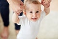 Happy baby learning to walk with mother help Royalty Free Stock Photo