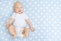 Happy Baby lying on Blue Carpet Background, Smiling Infant Kid Royalty Free Stock Photo