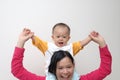 Happy baby on mother's shoulders