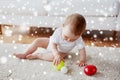 Happy baby playing with balls on floor at home Royalty Free Stock Photo