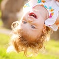 Happy baby playing upside down.