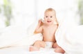 Happy baby under a blanket laughing Royalty Free Stock Photo