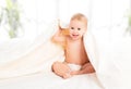 Happy baby under a blanket laughing Royalty Free Stock Photo